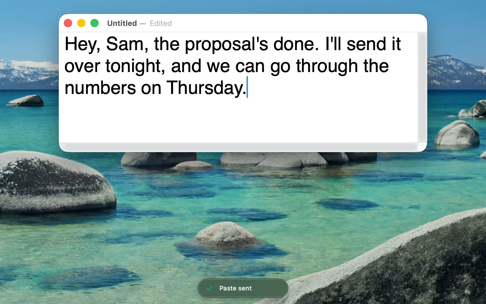 A TextEdit document on a Mac with a dictated message just pasted in, and the small Quick Dictate pill below it saying Paste sent